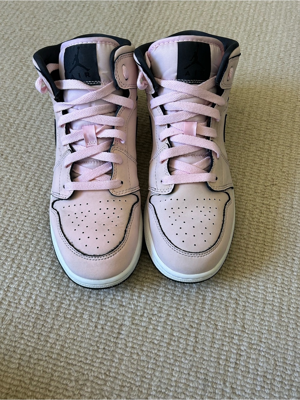 Jordan Woman’s Light Pink High-Top Sneakers with Black Accents